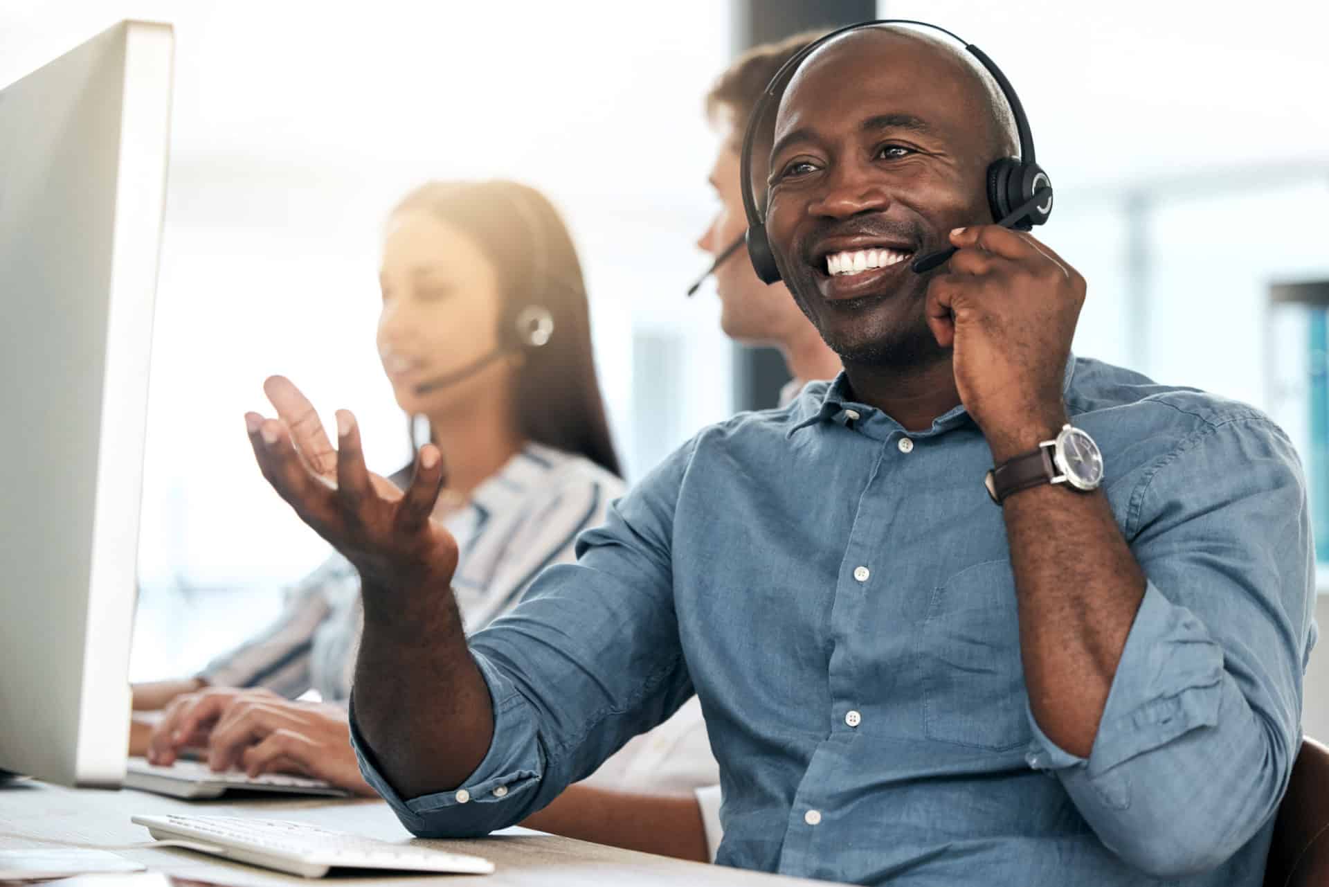 sales recruiter on the phone blue shirt