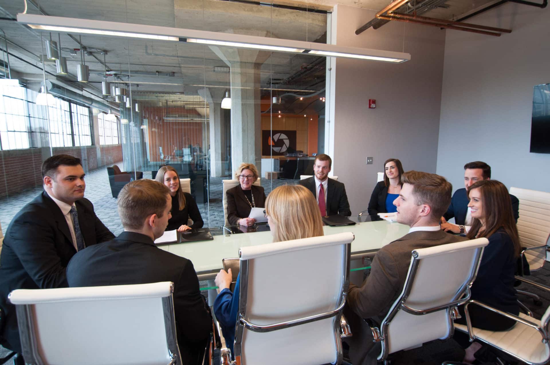 team of recruiters working around a table together