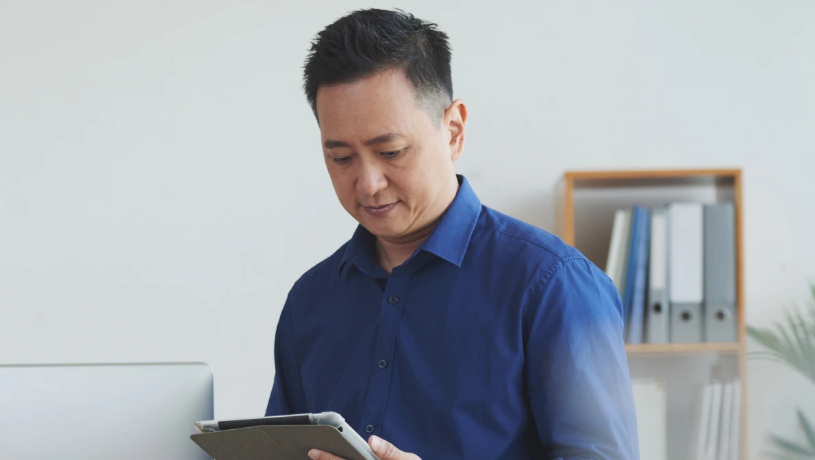 sales management recruiter reading a tablet