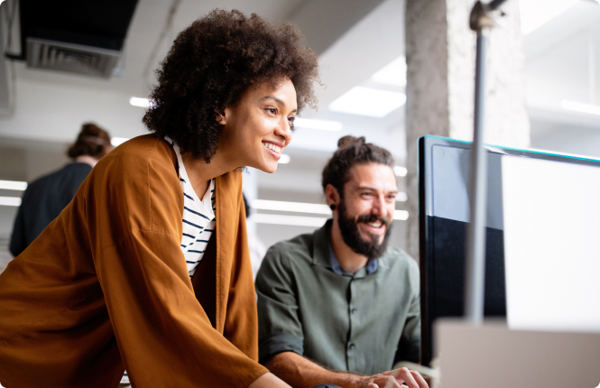 two inbound marketing recruitment professionals working together at computer