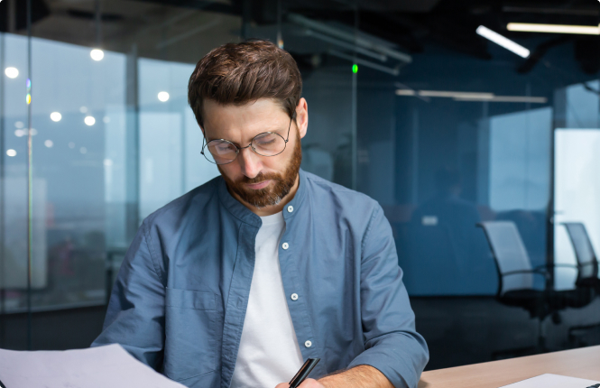 cpa recruitment professional with glasses working at desk
