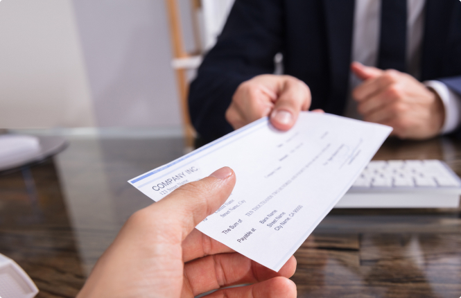 payroll paycheck being handed off - Search Solution Group payroll paycheck being handed out in the office
