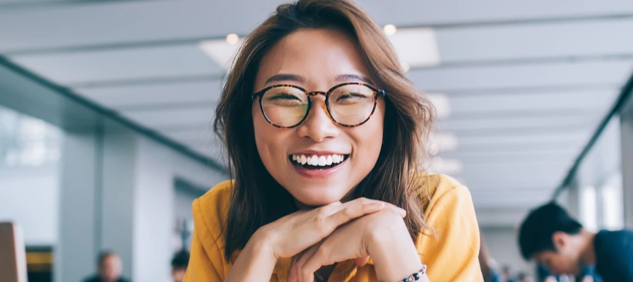 environmental health recruiter smiling with hands folded