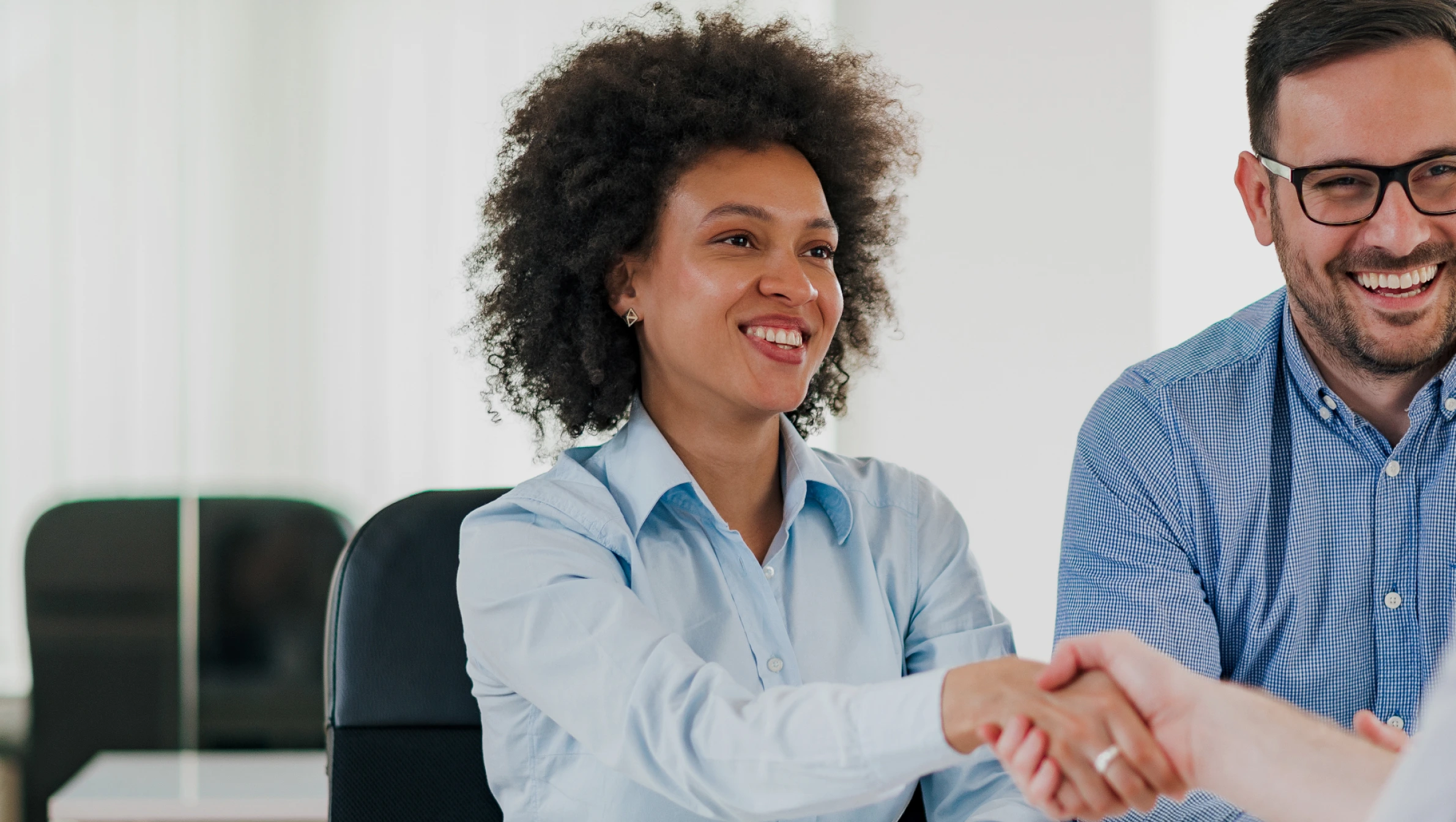 recruiters shaking hands with candidate