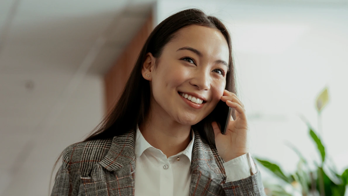 inside sales recruiter smiling on the phone