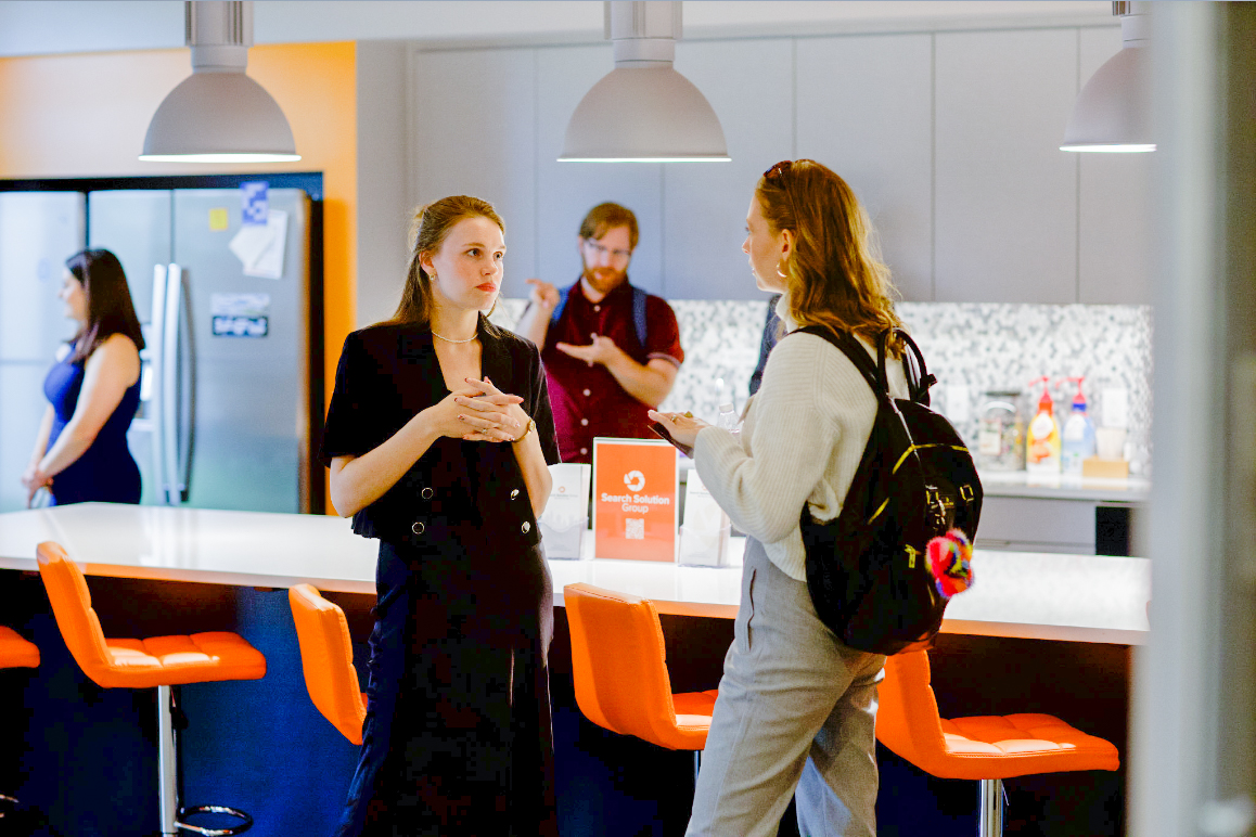 team of recruiters working around a table together