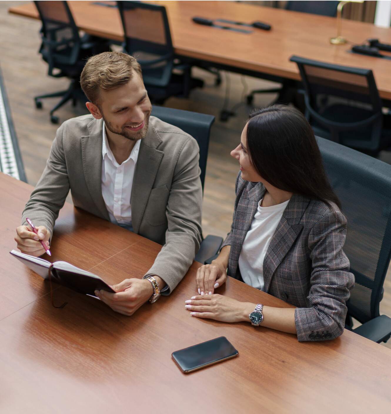 Two executive recruiters talking about fractional leadership candidates.
