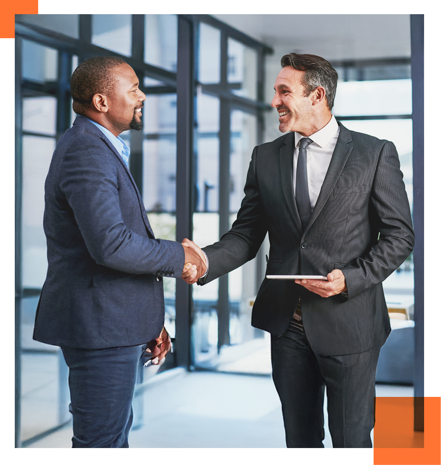 two male professionals shaking hands