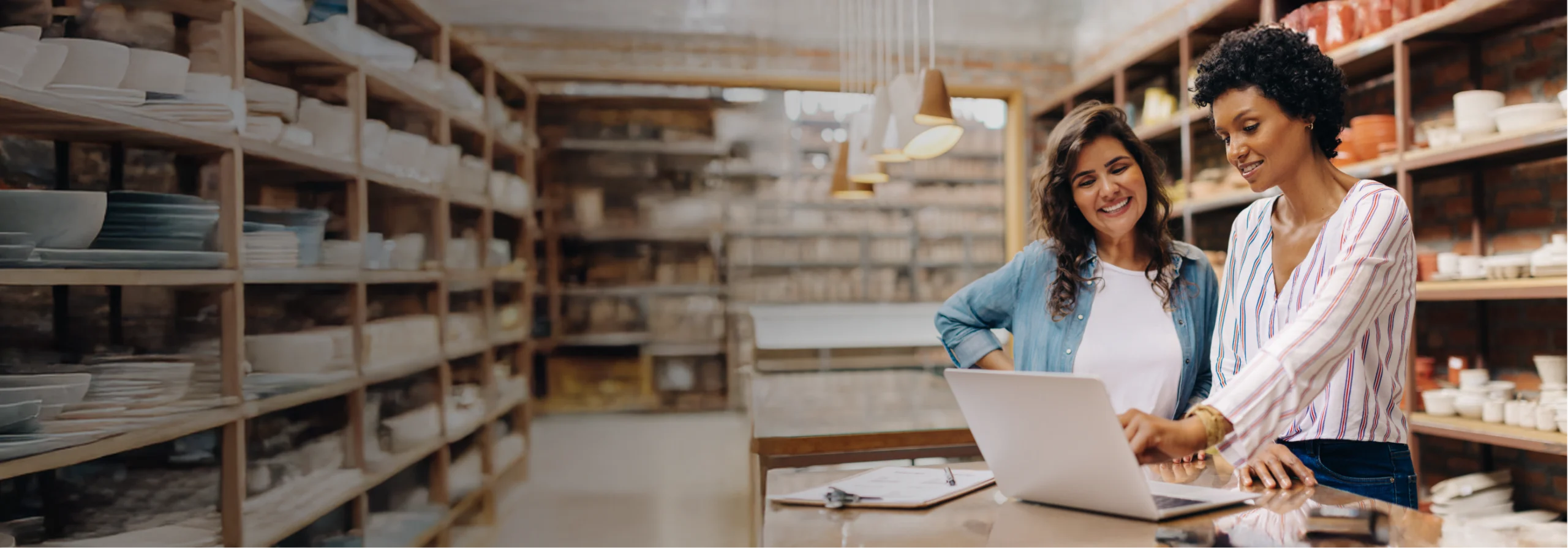 Two Females At Retail Store Working