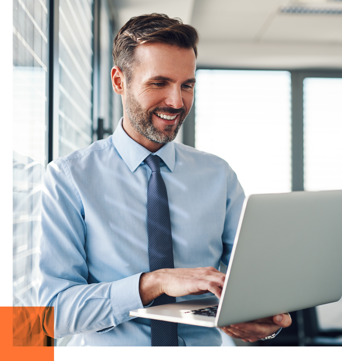 male consultant looking at laptop