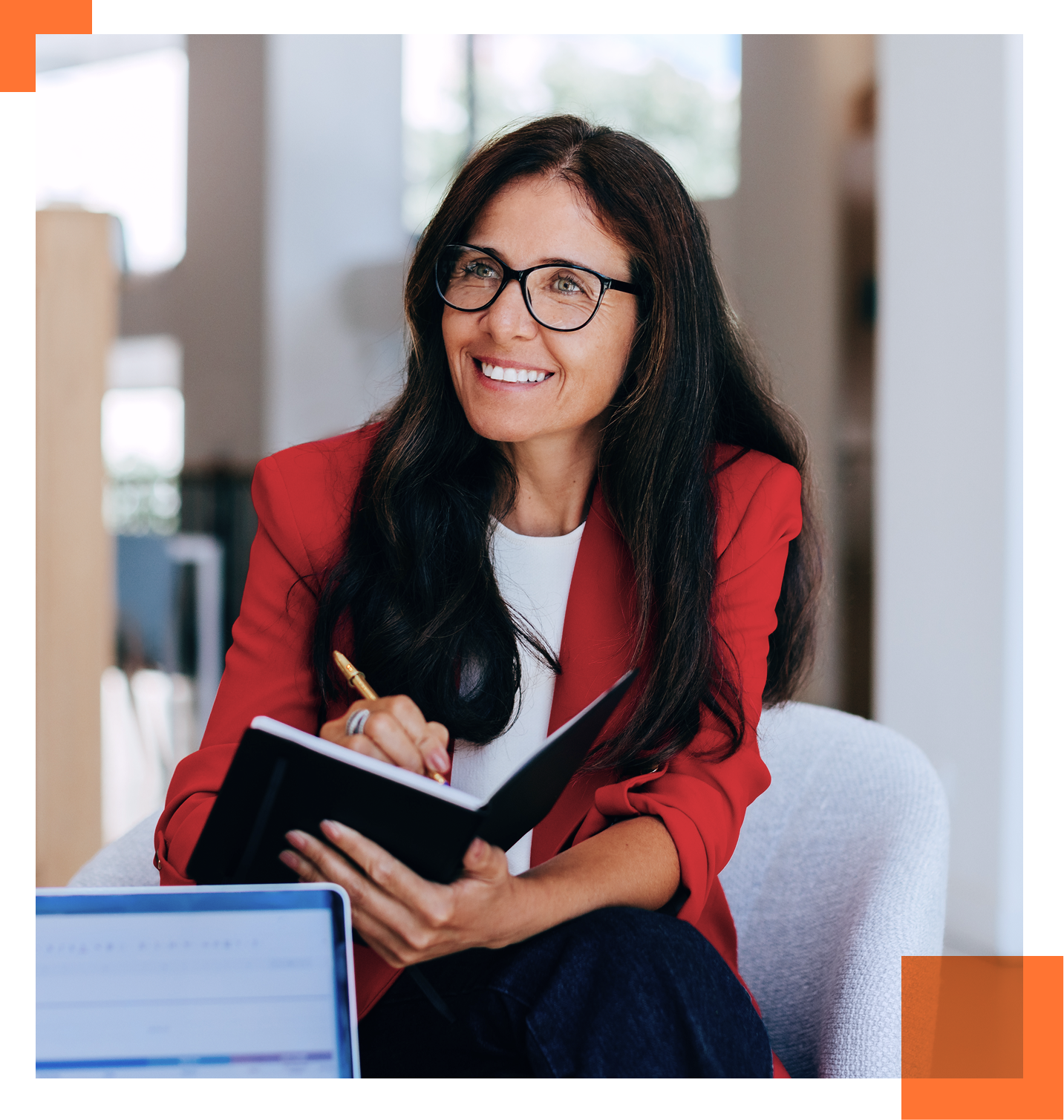 Female CEO writing in notebook