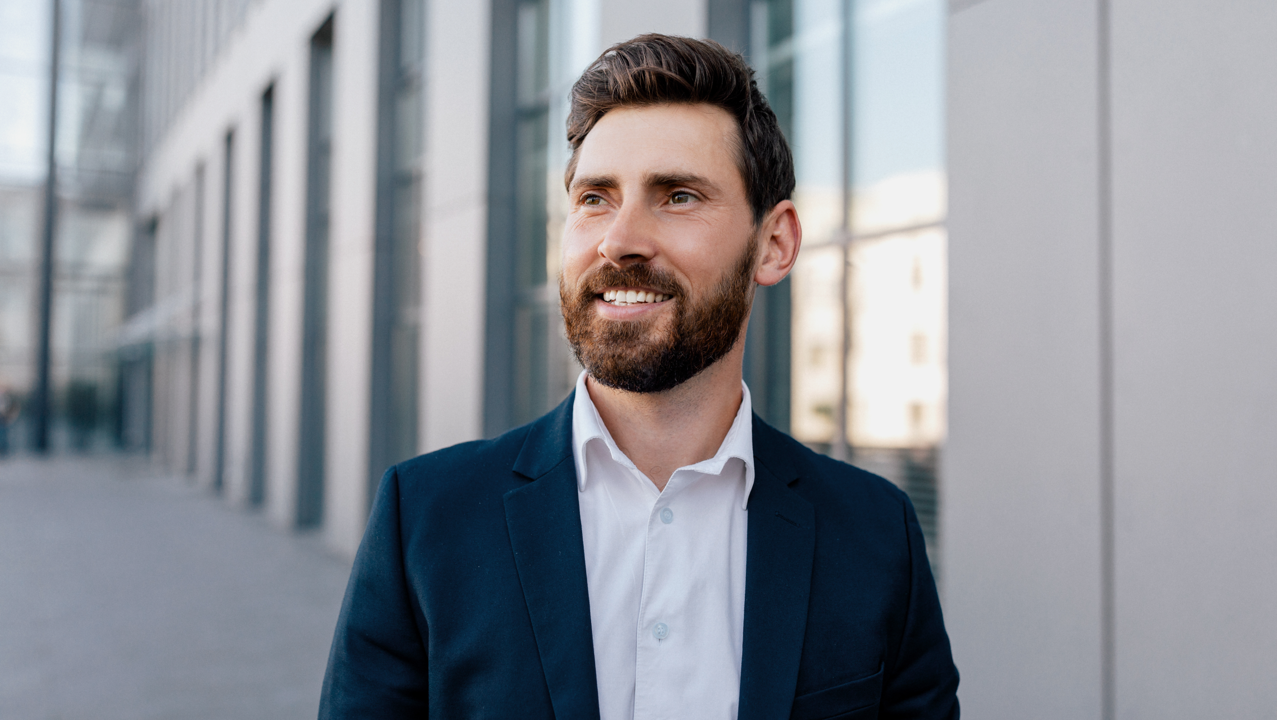 Male CEO outside building