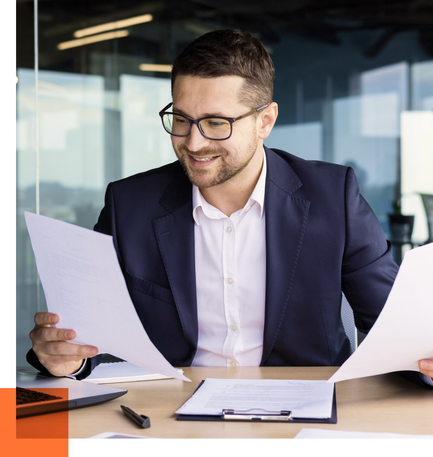 Male CFO looking at papers