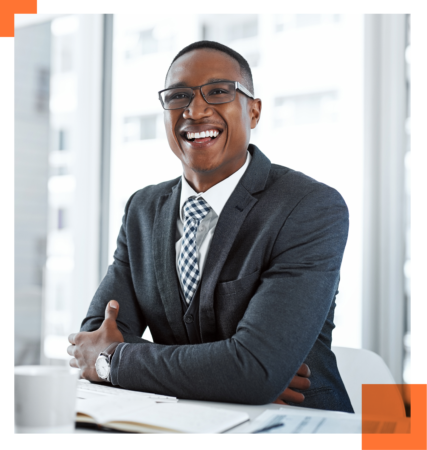 Male CHRO in suite sitting at desk