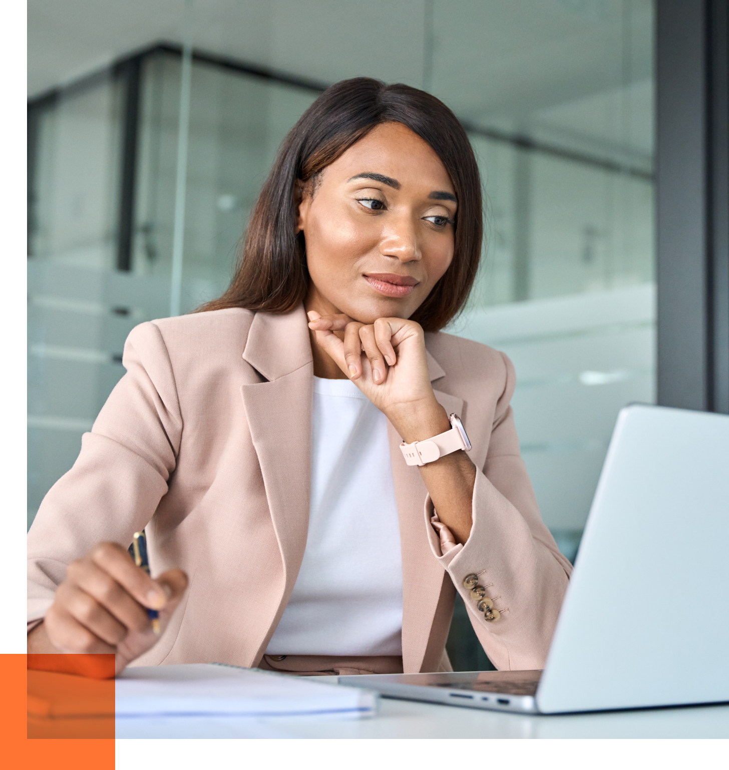 female cmo looking at laptop