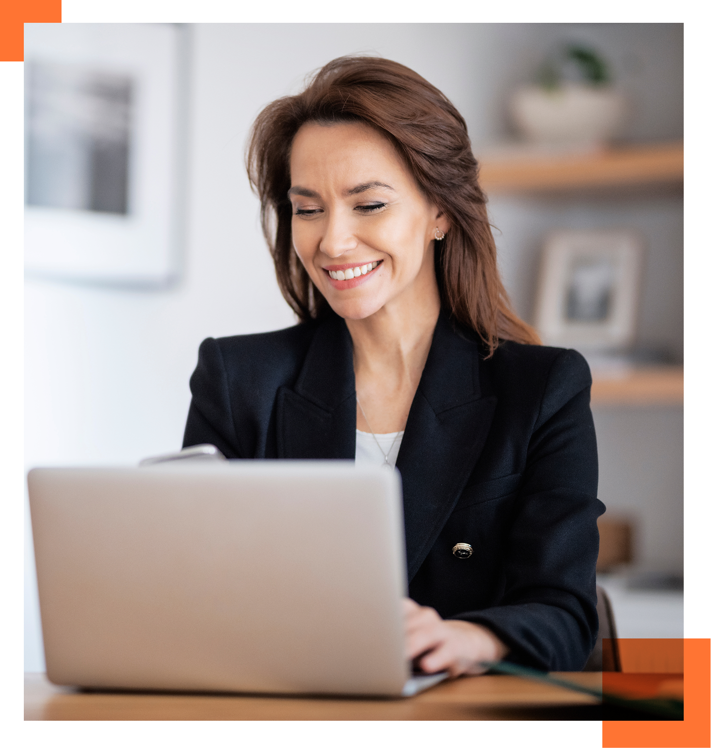 female CTO looking at laptop